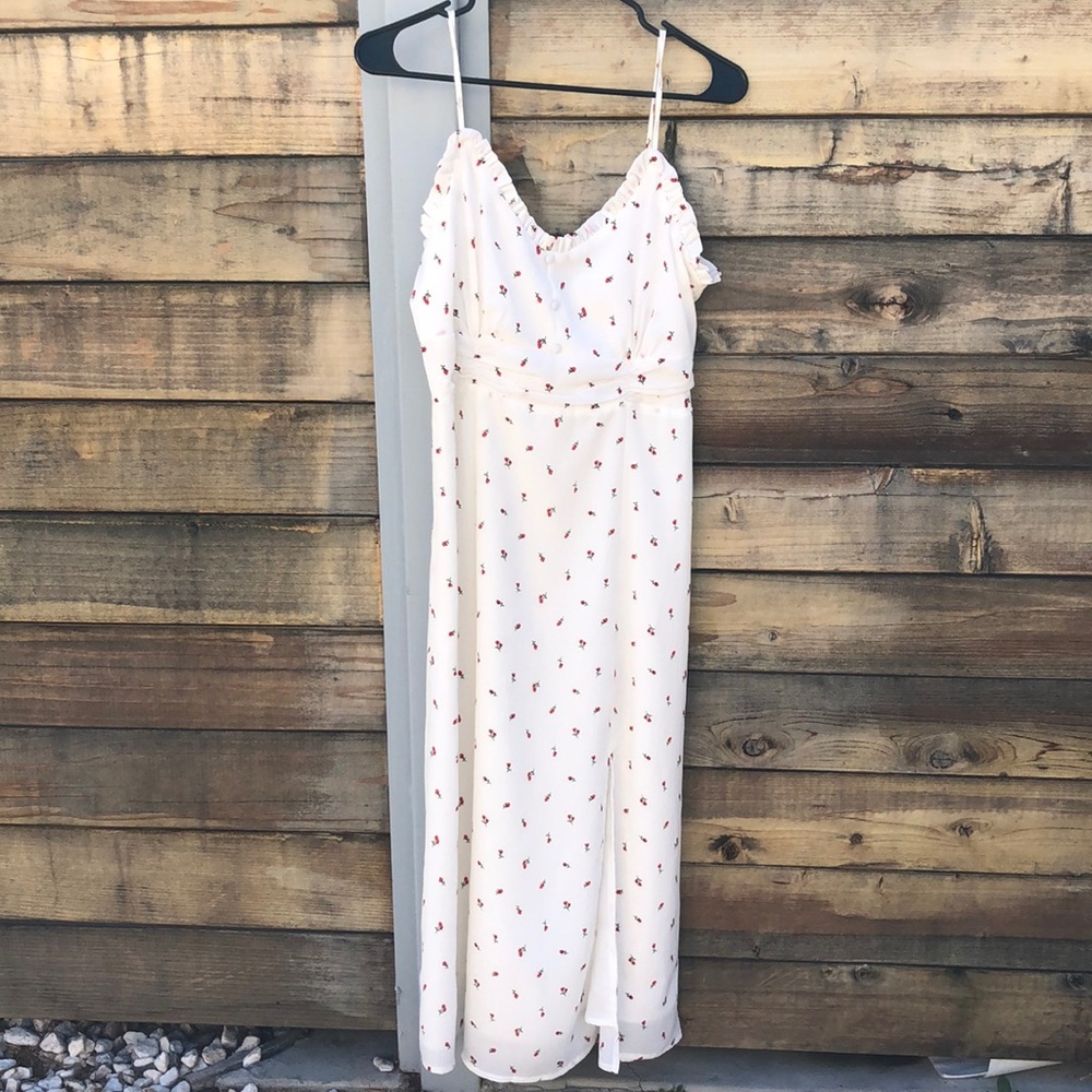 A white spaghetti strap sun dress with baby roses